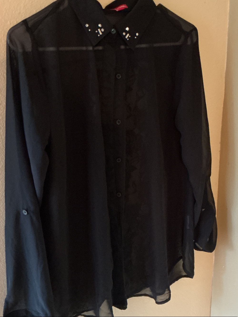 Black Woman’s Sheer Button-Down Blouse with Studded Collar